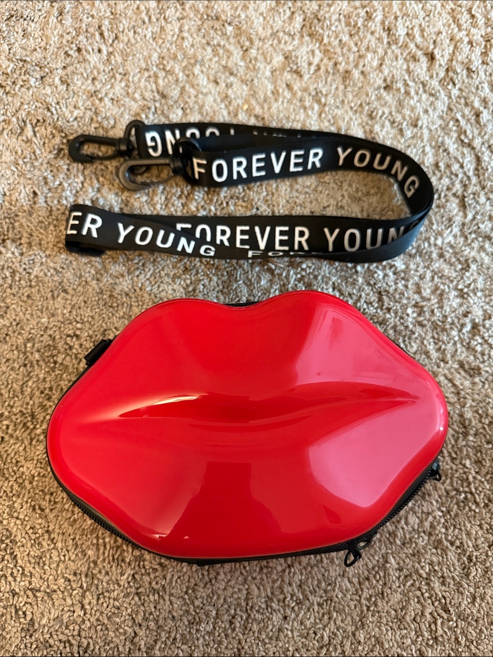 Forever Young Red Lip-Shaped Crossbody Bag with Black Logo Strap